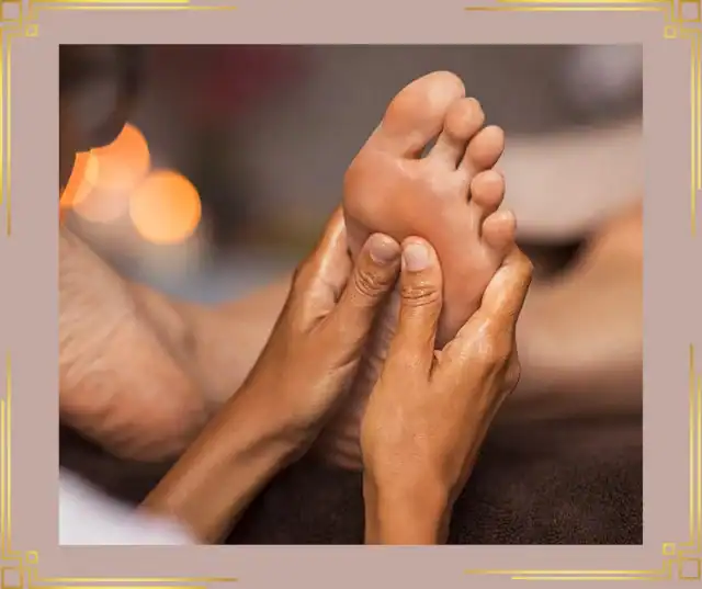 Reflexology on patient foot