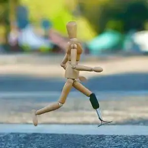 wooden man figure walking